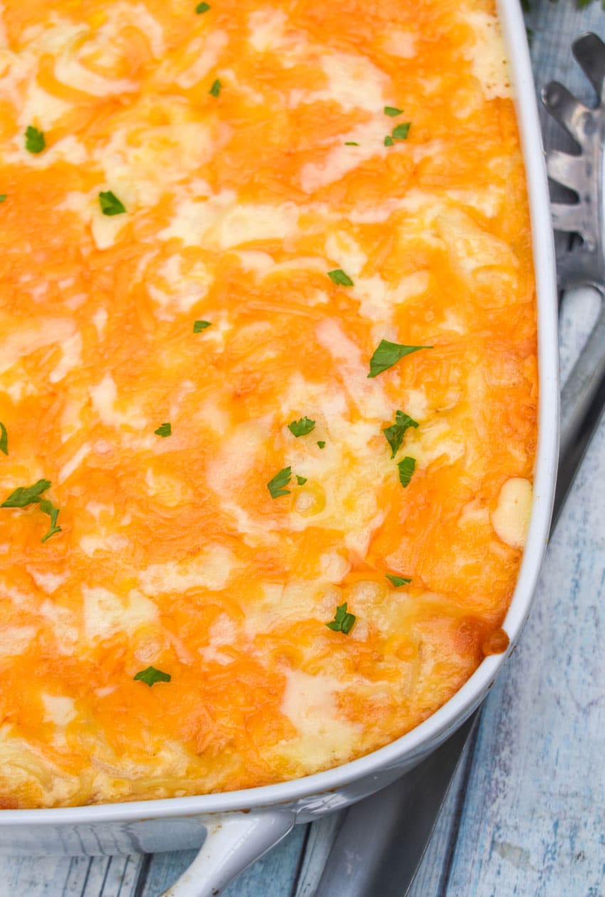 baked spaghetti mac and cheese in a white casserole dish