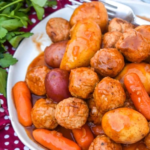 meatball pot roast served on a small white dinner plate