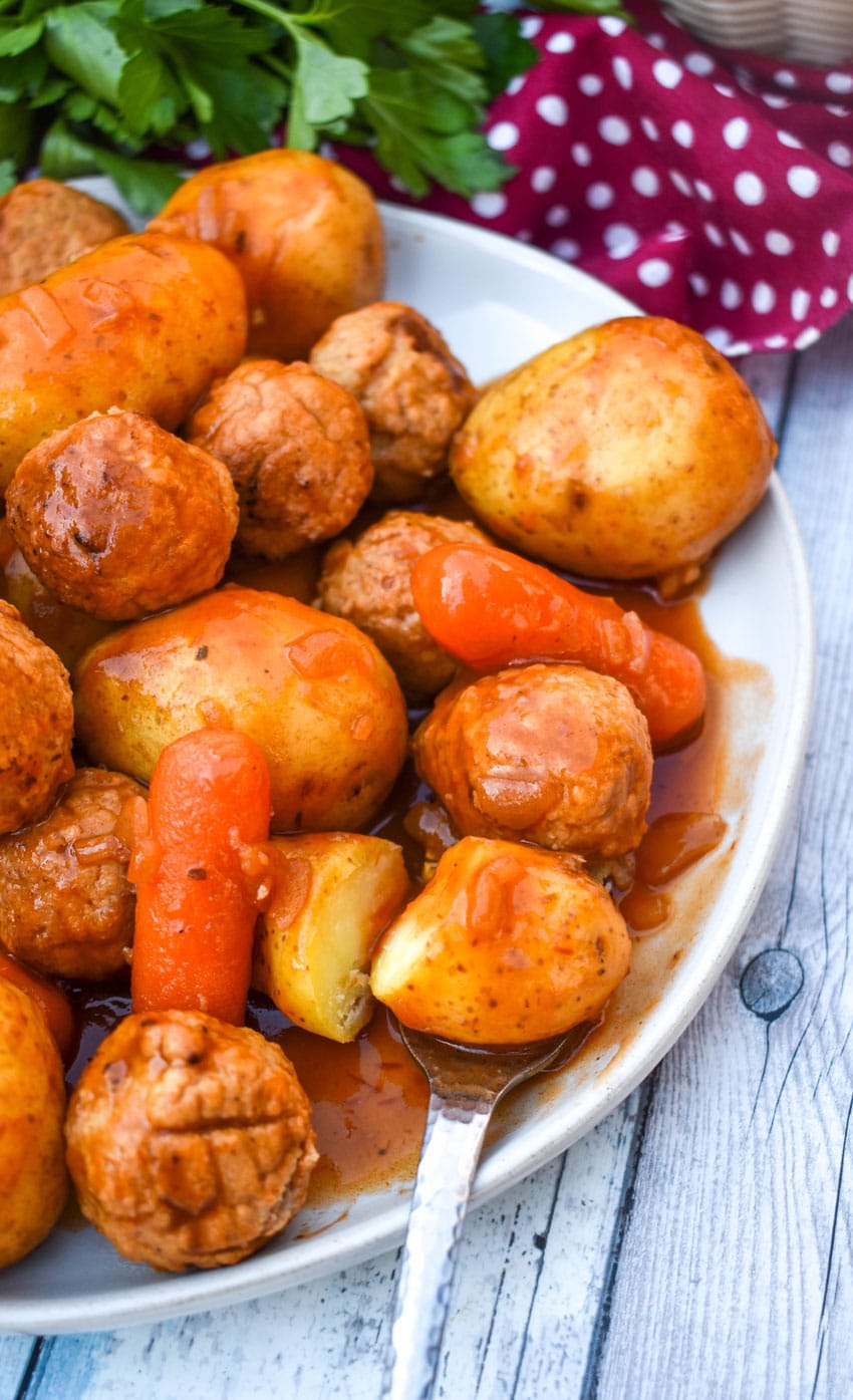 meatball pot roast served on a small white dinner plate