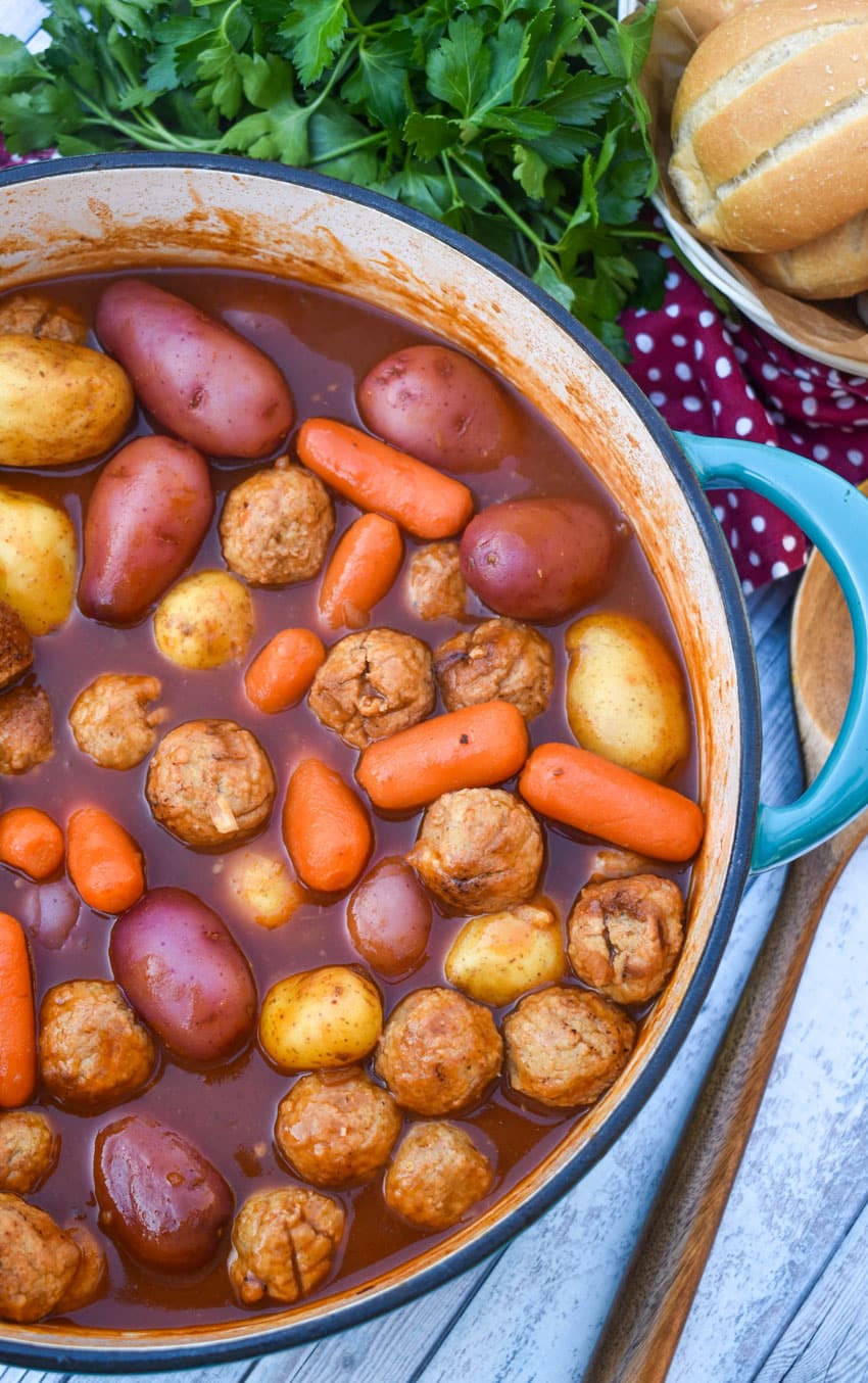 meatball pot roast in a large blue dutch oven