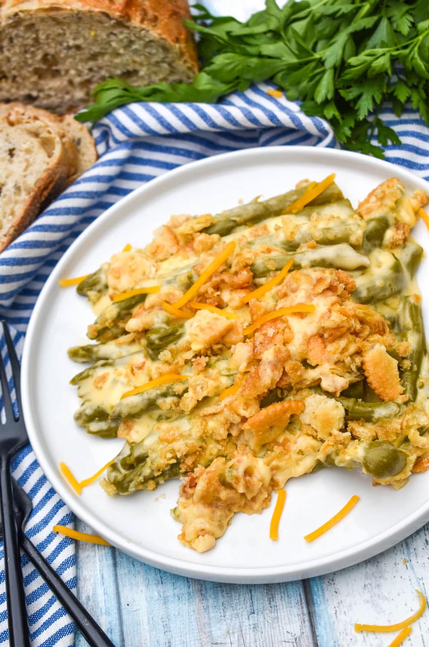 cheesy asparagus casserole served on a white plate
