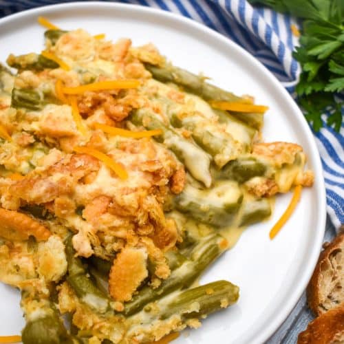 cheesy asparagus casserole served on a white plate