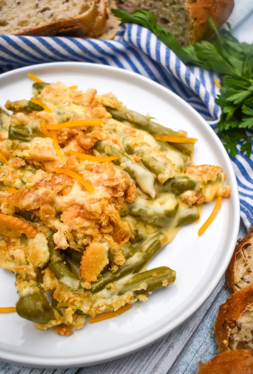 cheesy asparagus casserole served on a white plate