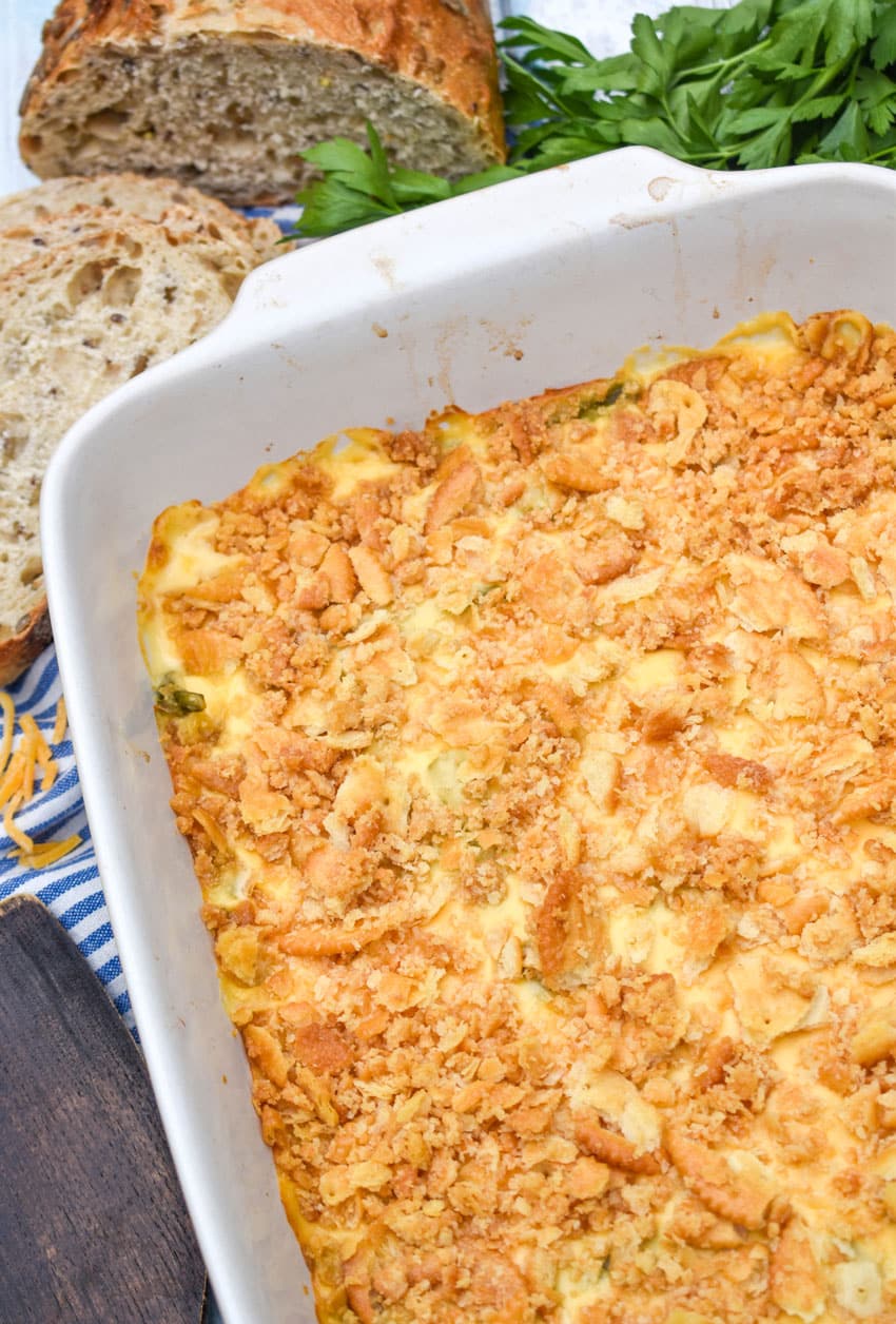 cheesy asparagus casserole in a white baking dish