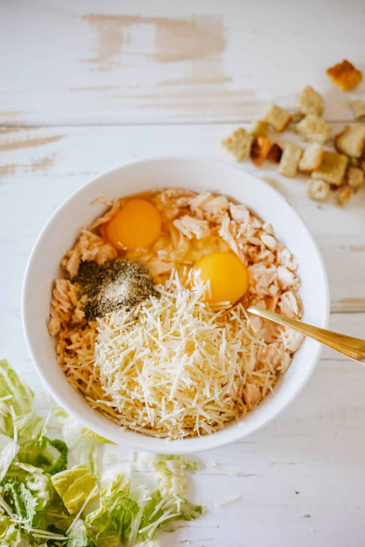 chicken pizza crust ingredients in a small white mixing bowl