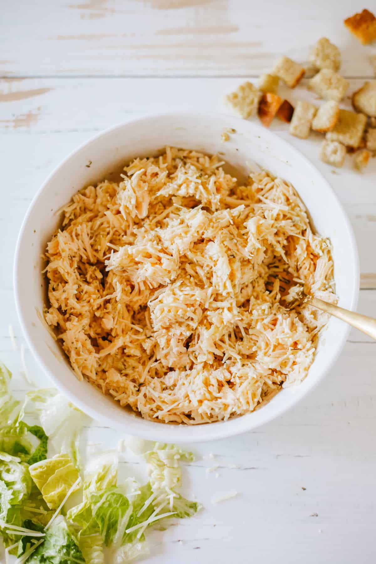 chicken pizza crust ingredients mixed together in a small white mixing bowl