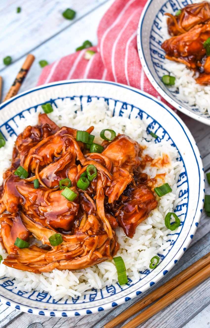instant pot teriyaki chicken over steamed white rice in a white bowl