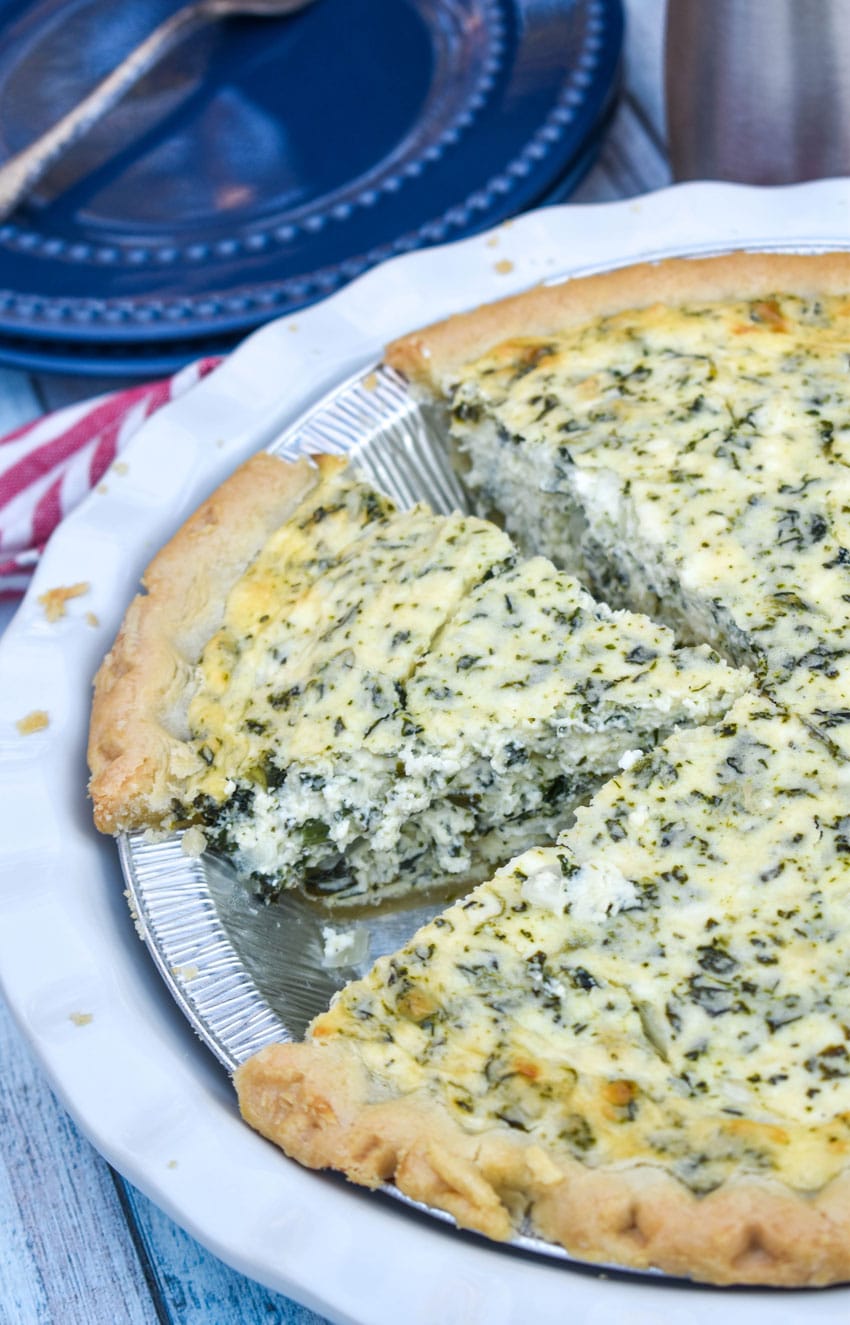 Creamed Spinach Pie a sliced creamed spinach pie in a white pie plate