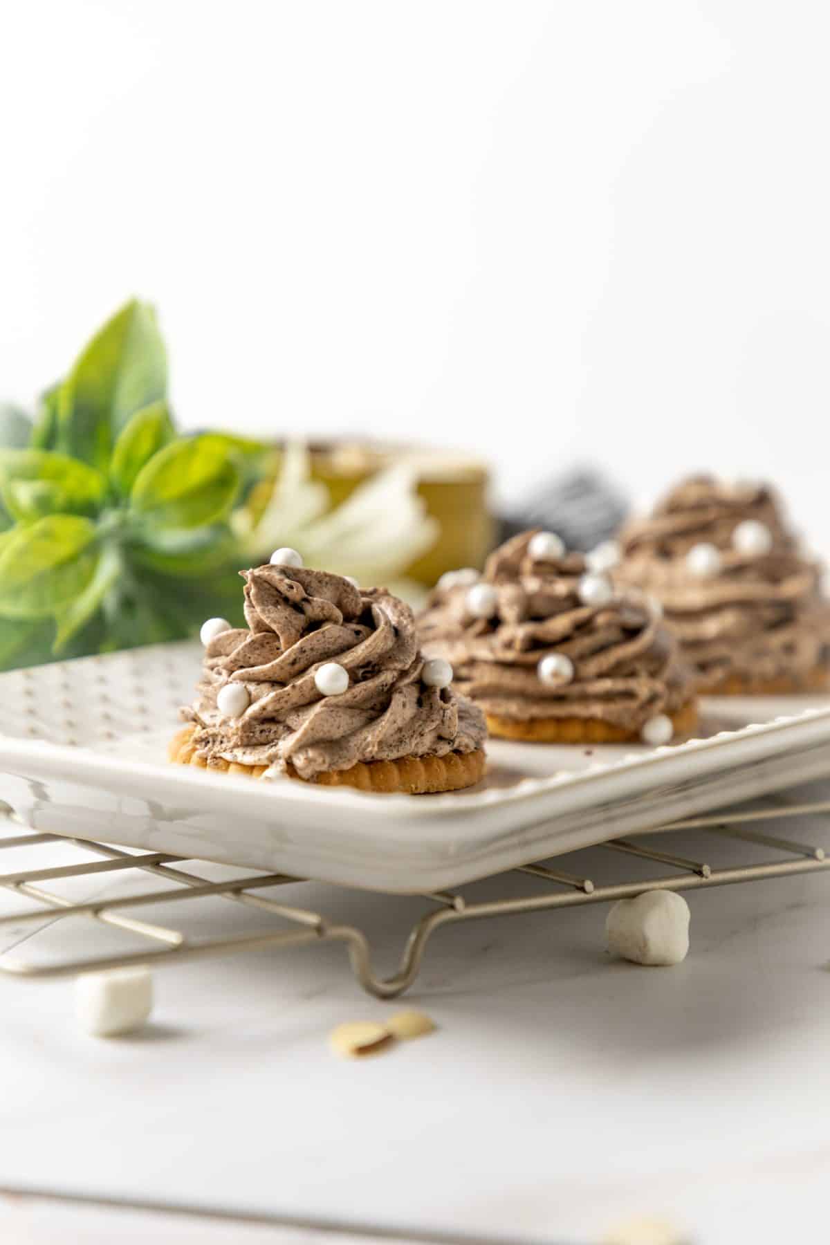disney's the grey stuff piped into swirls on a white serving platter