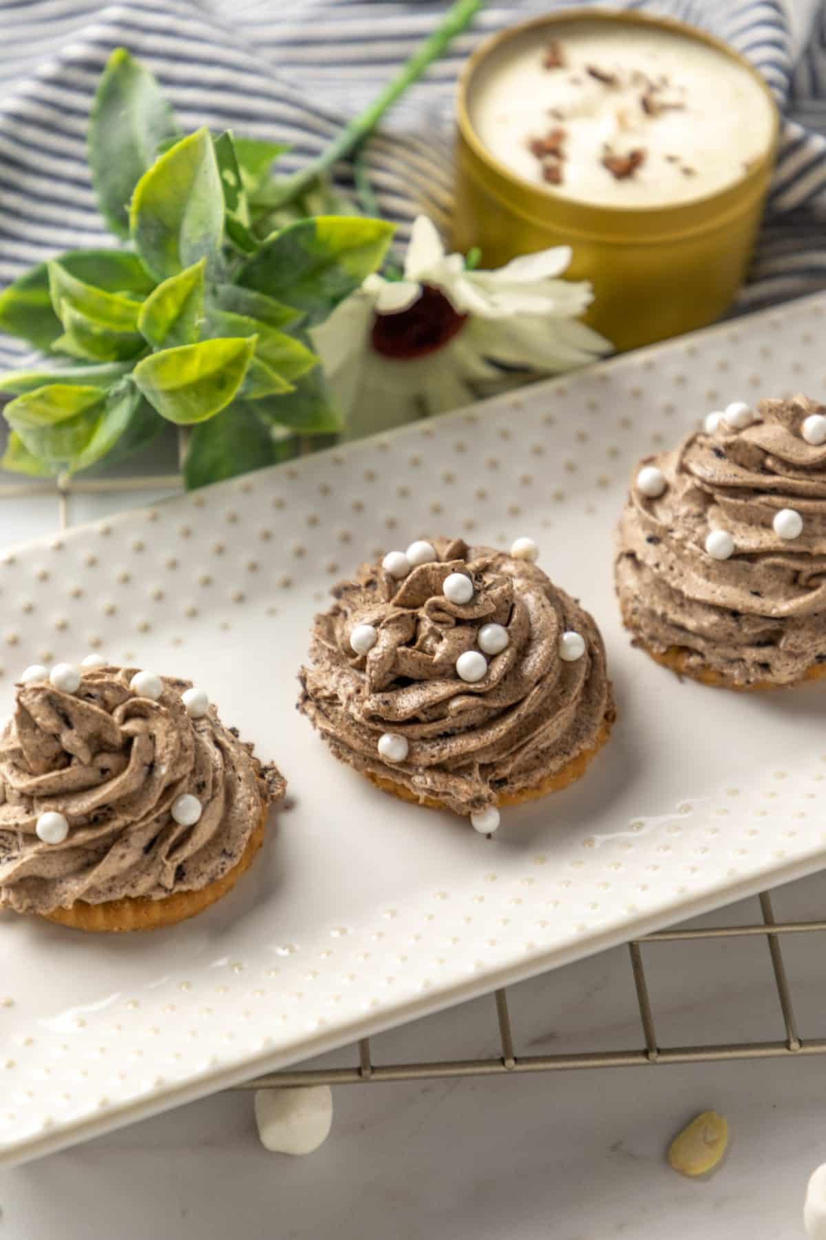 disney's the grey stuff piped into swirls on a white serving platter