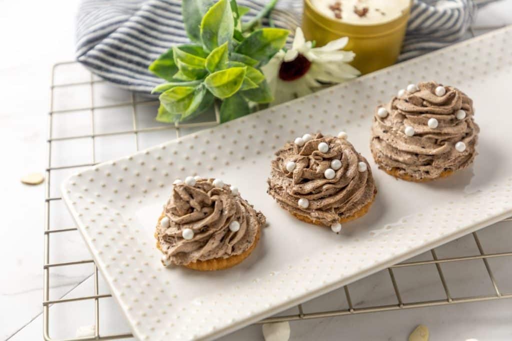disney's the grey stuff piped into swirls on a white serving platter