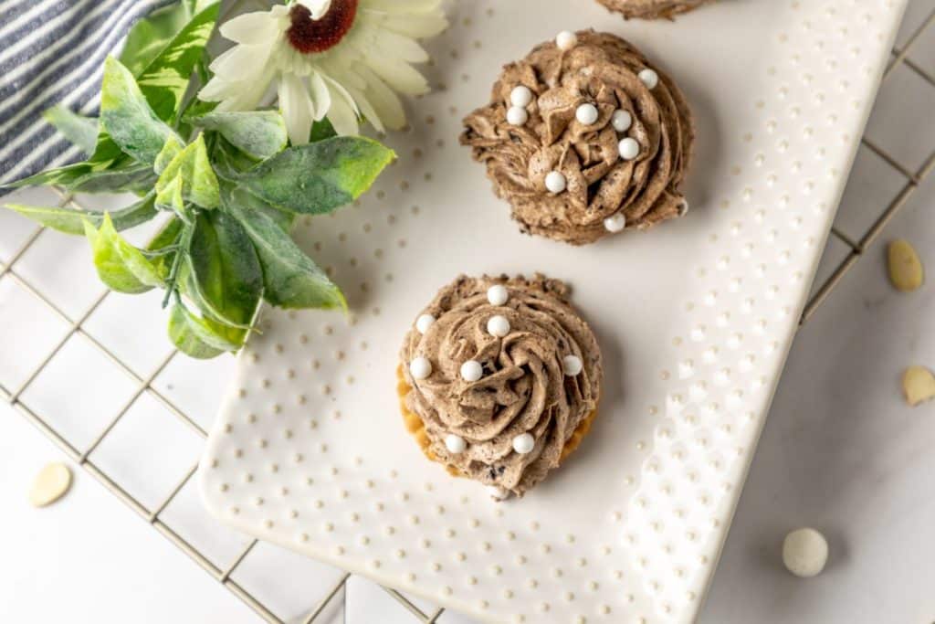 disney's the grey stuff piped into swirls on a white serving platter