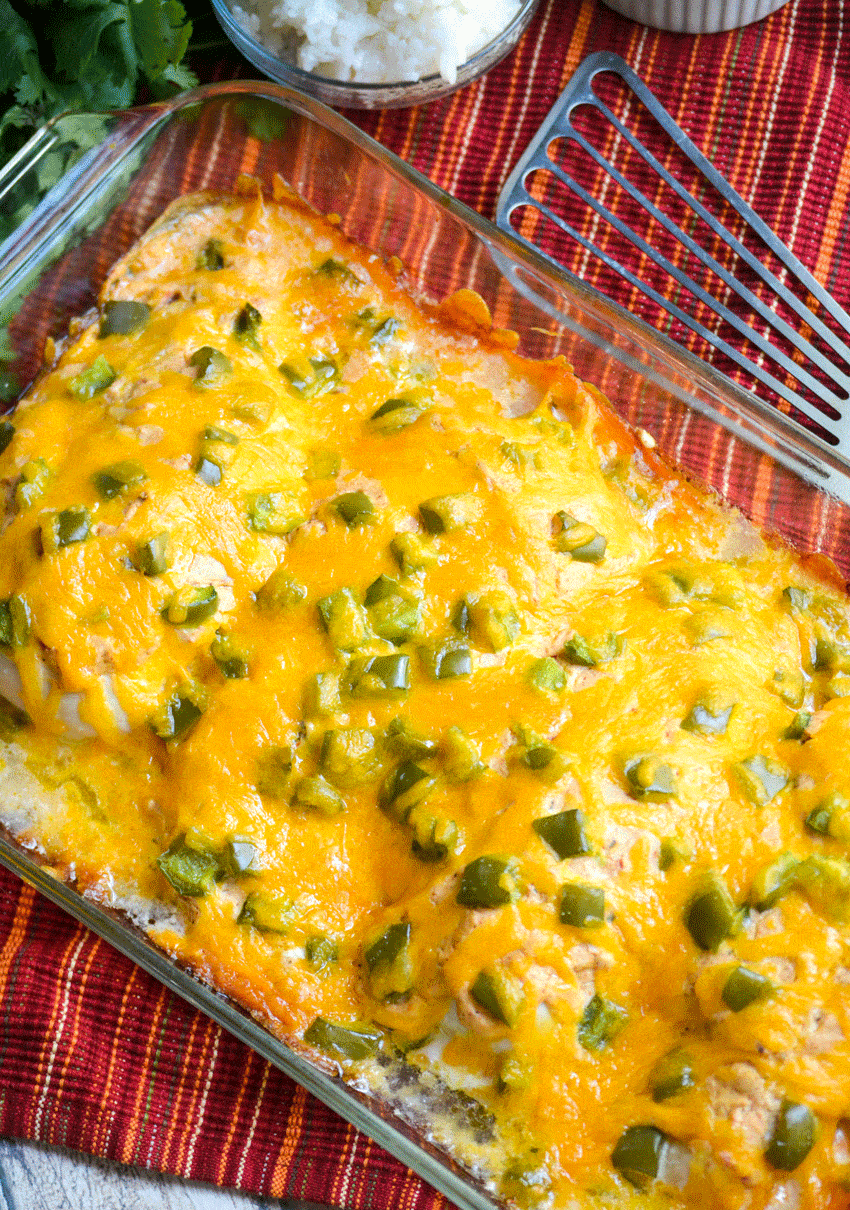 baked cheesy fajita chicken in a glass baking dish