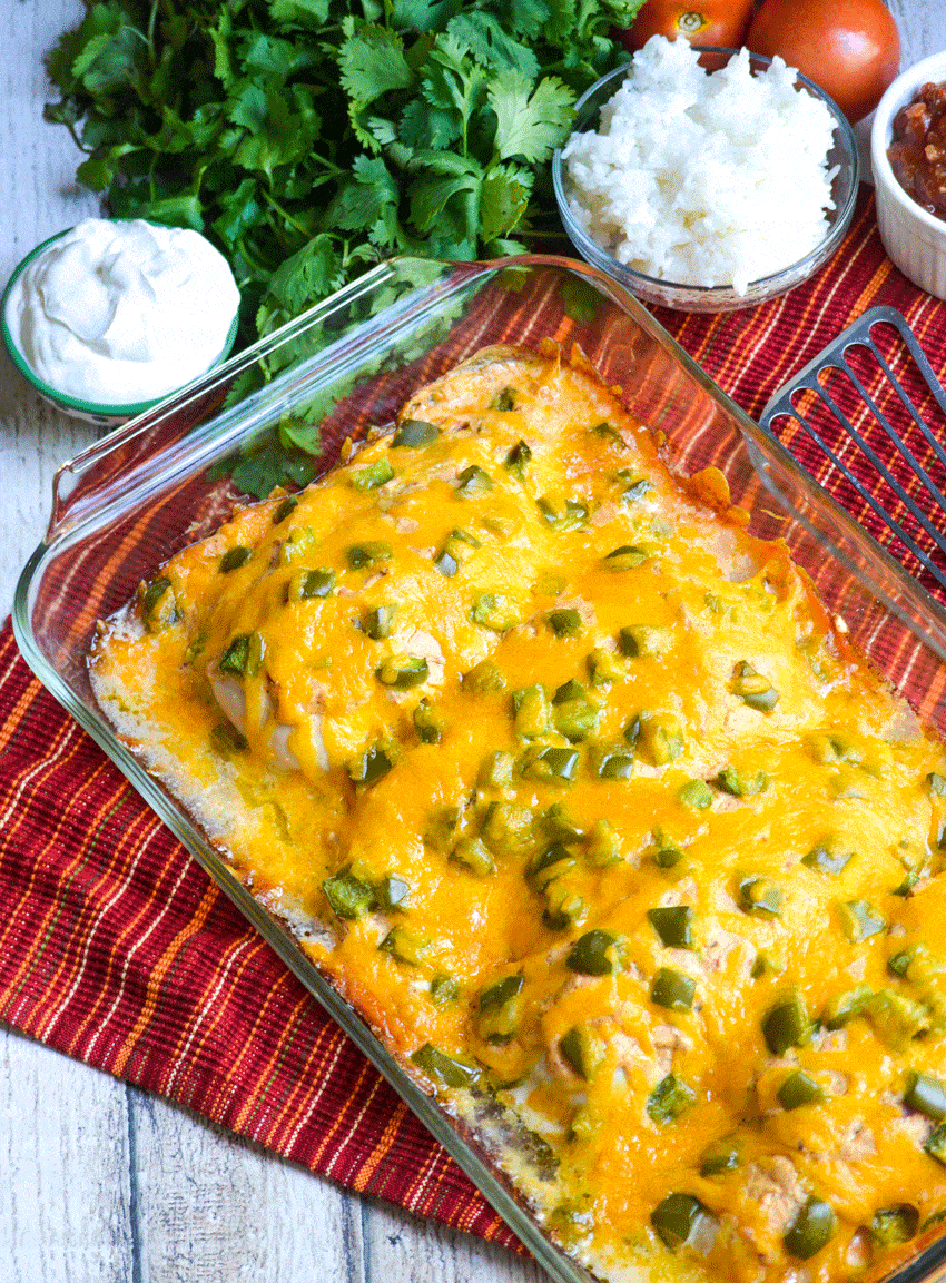 baked cheesy fajita chicken in a glass baking dish