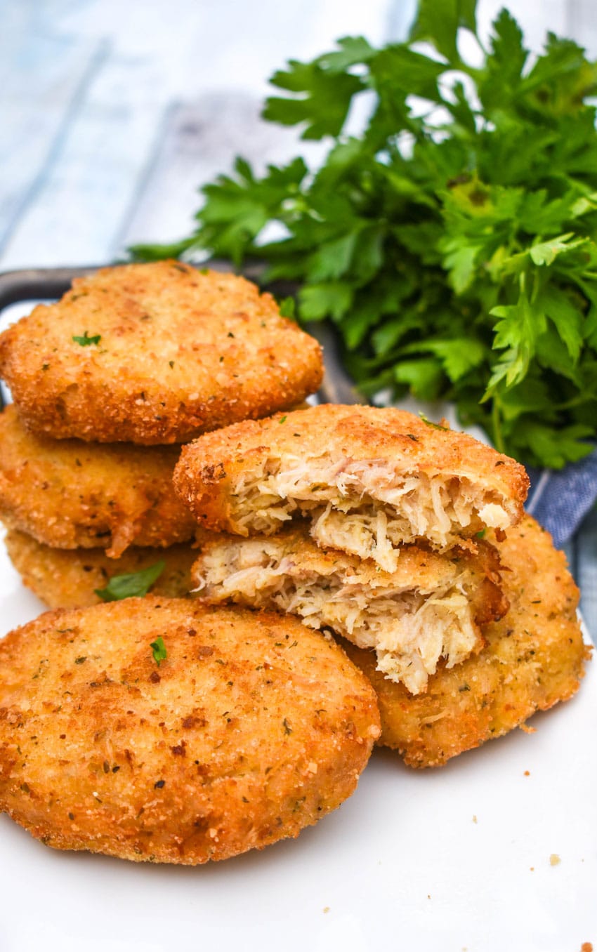 crispy chicken fritters on a white serving plate