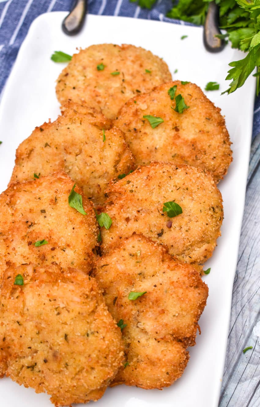 crispy chicken fritters on a white serving plate