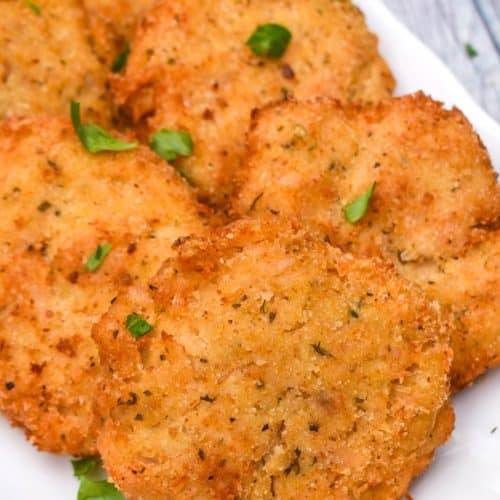 crispy chicken fritters on a white serving plate