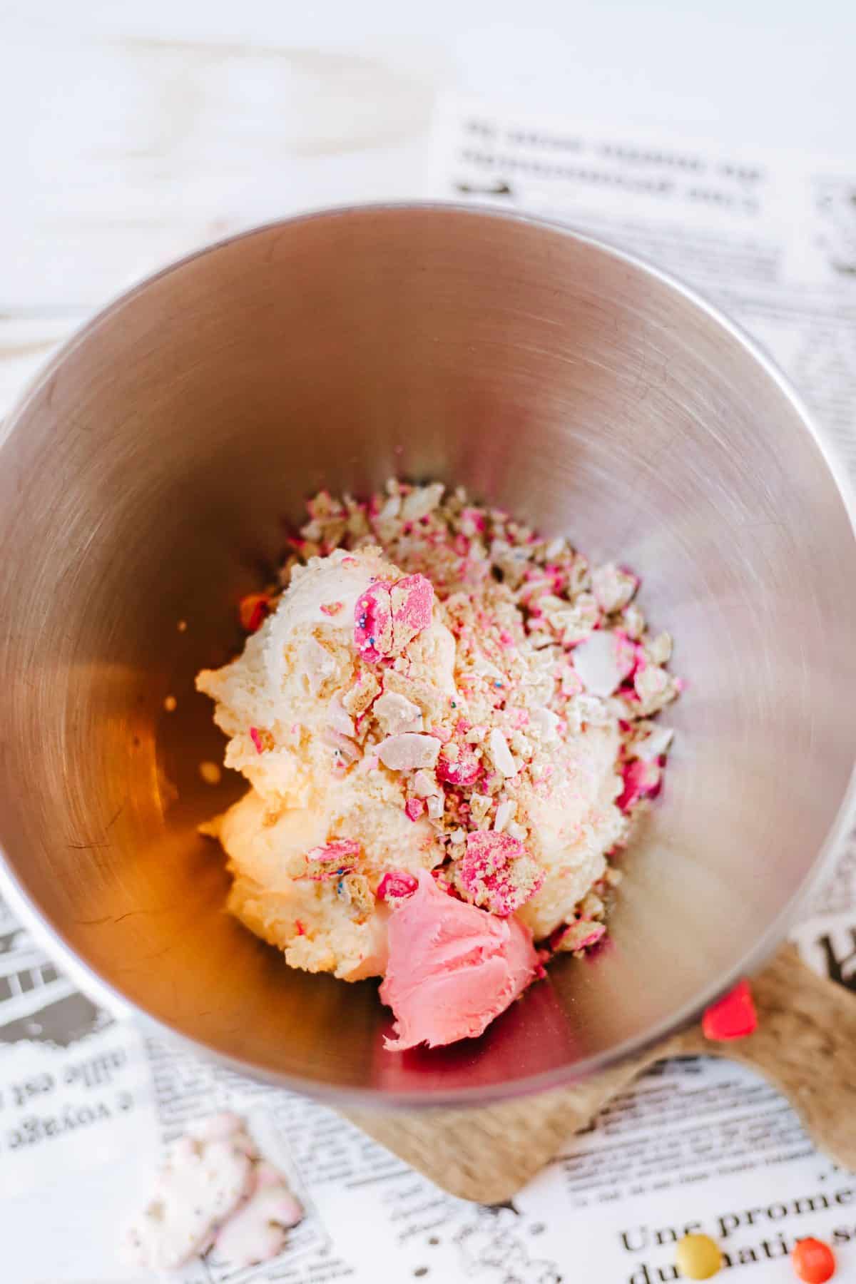 homemade circus cookie blizzard ingredients in a metal mixing bowl