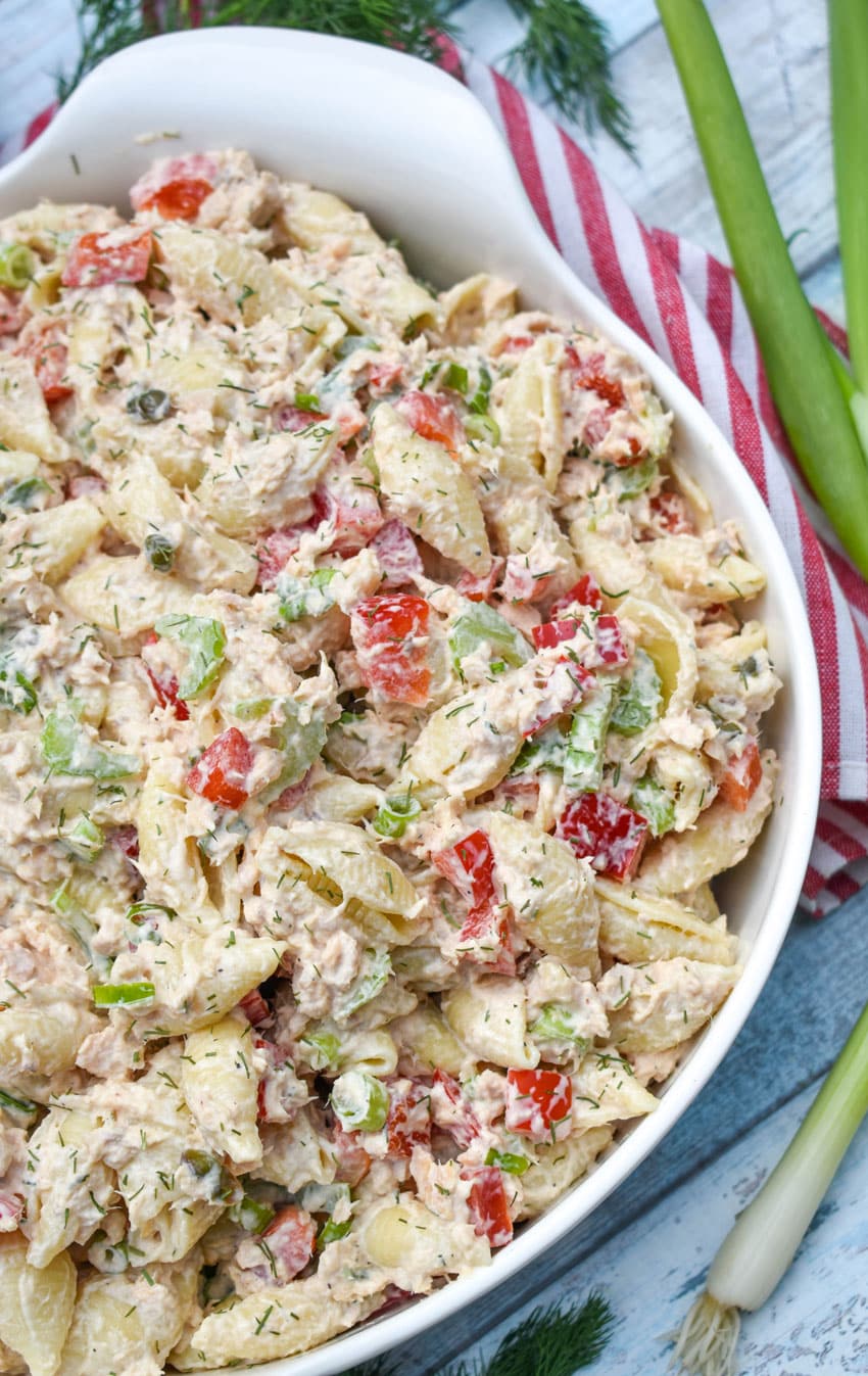 canned salmon pasta salad in a large white serving bowl