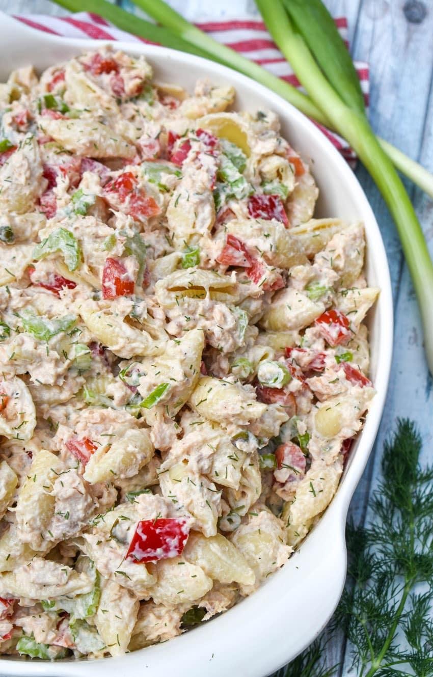 canned salmon pasta salad in a large white serving bowl