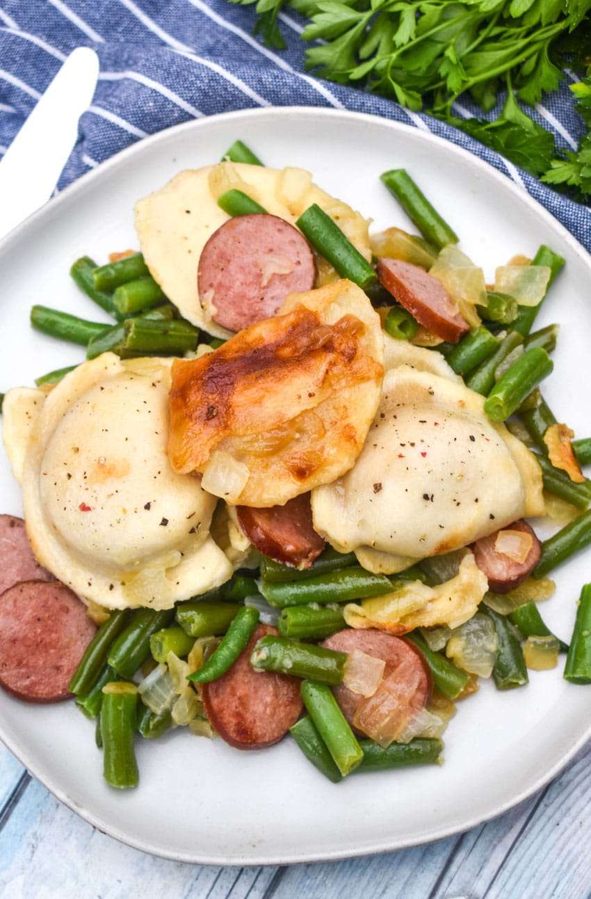 One Pot Sausage And Pierogi Skillet served on a white plate