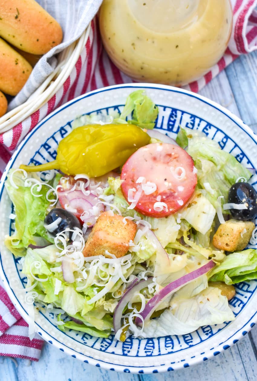 a homemade olive garden salad in a small salad bowl