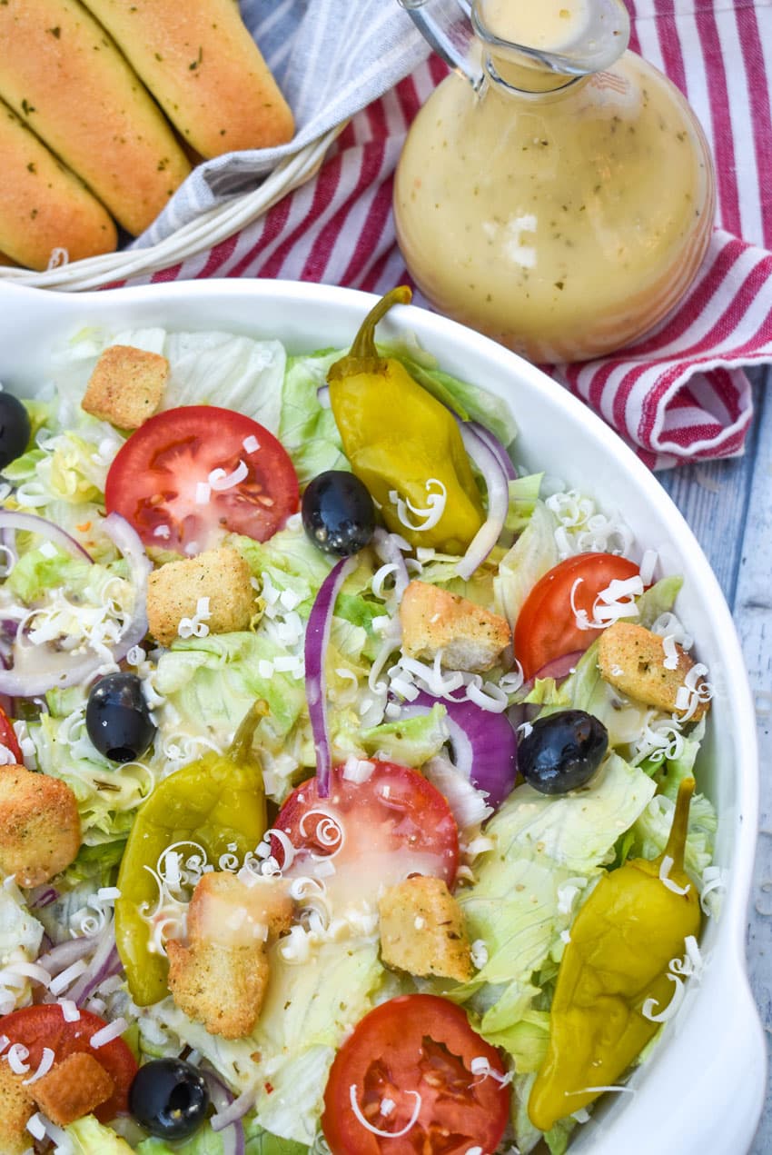 copycat olive garden salad in a blue and white bowl