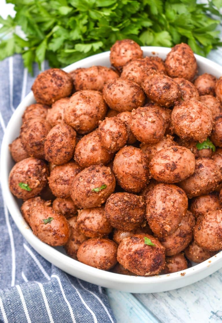 smoked baby potatoes in a small white serving bowl