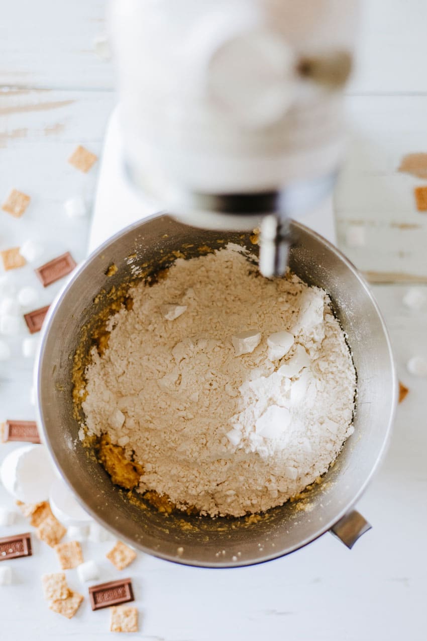 cookie cake batter ingredients in a metal mixing bowl