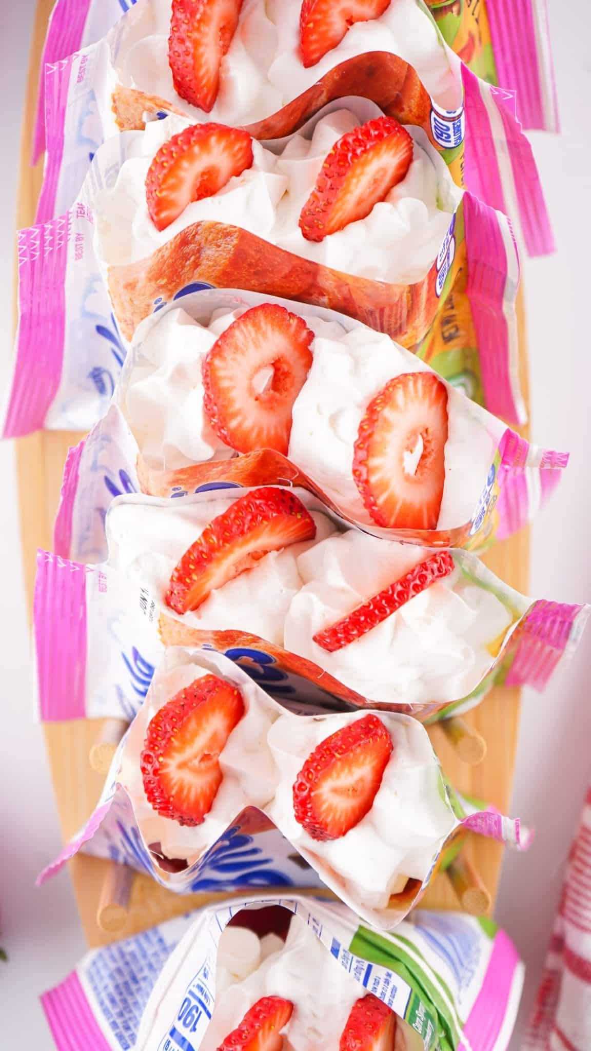 walking strawberry shortcake dessert sitting up and arranged in a row