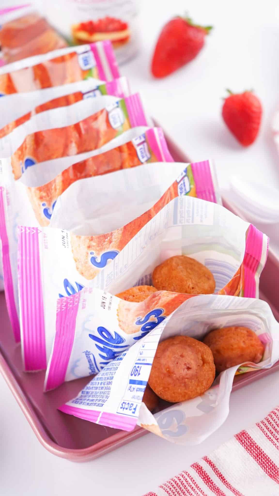 opened packages of little bite muffins arranged in a row