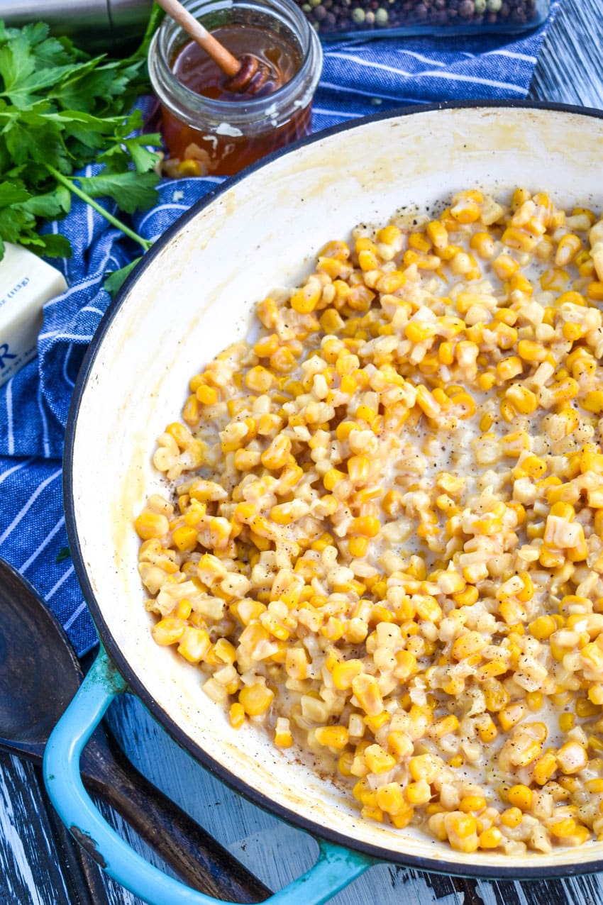 creamy honey butter skillet corn in a cast iron skillet