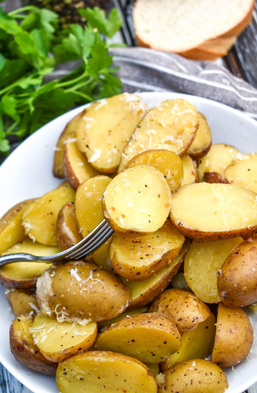 instant pot italian potatoes in a small white serving bowl