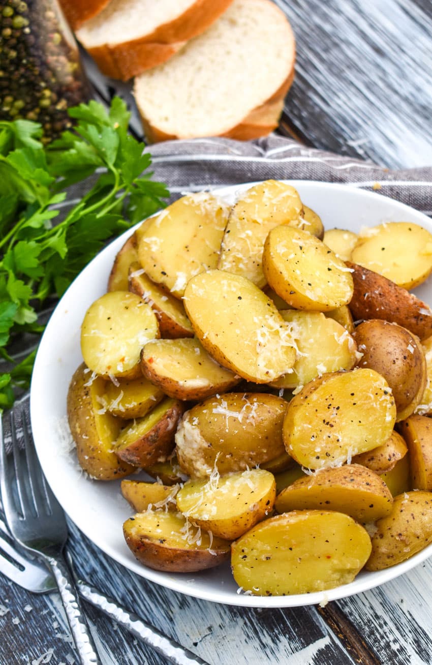 instant pot italian potatoes in a small white serving bowl