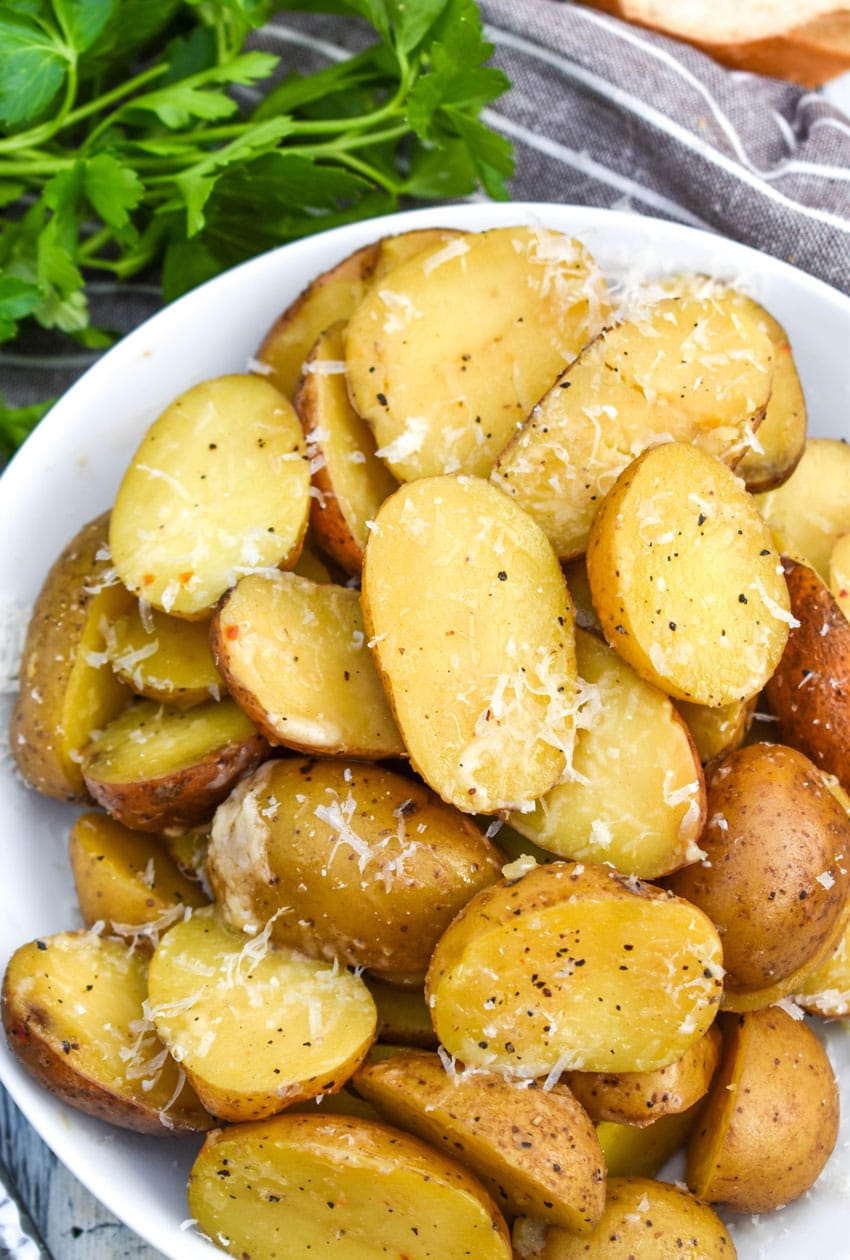 instant pot italian potatoes in a small white serving bowl