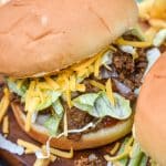 copycat taco bell big bell beefer sandwich on a wooden cutting board