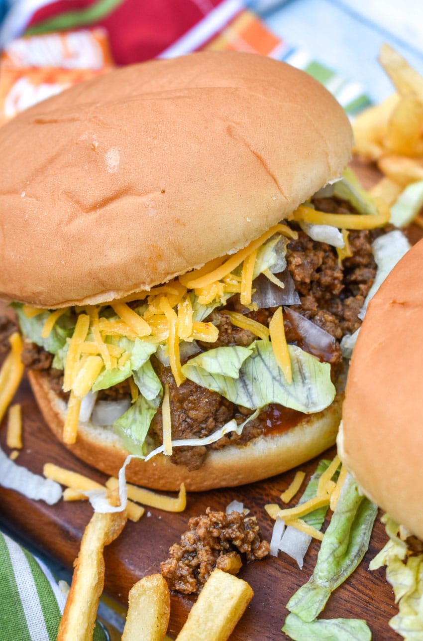 copycat taco bell big bell beefer sandwich on a wooden cutting board