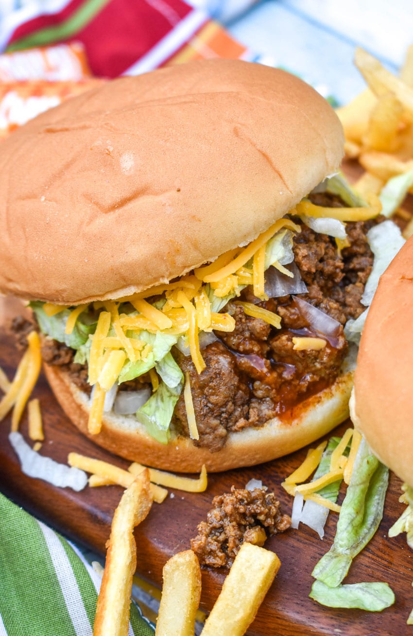 copycat taco bell big bell beefer sandwich on a wooden cutting board