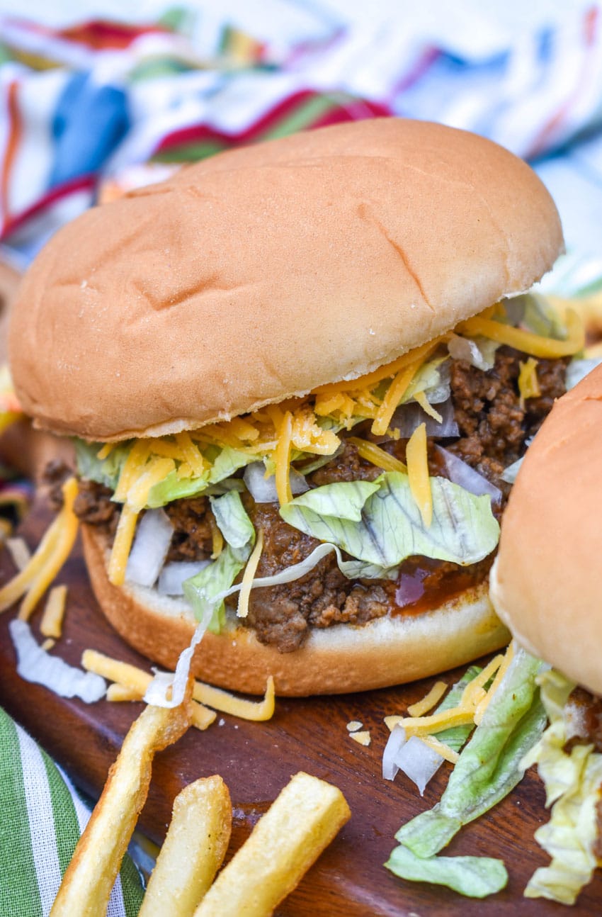 copycat taco bell big bell beefer sandwich on a wooden cutting board