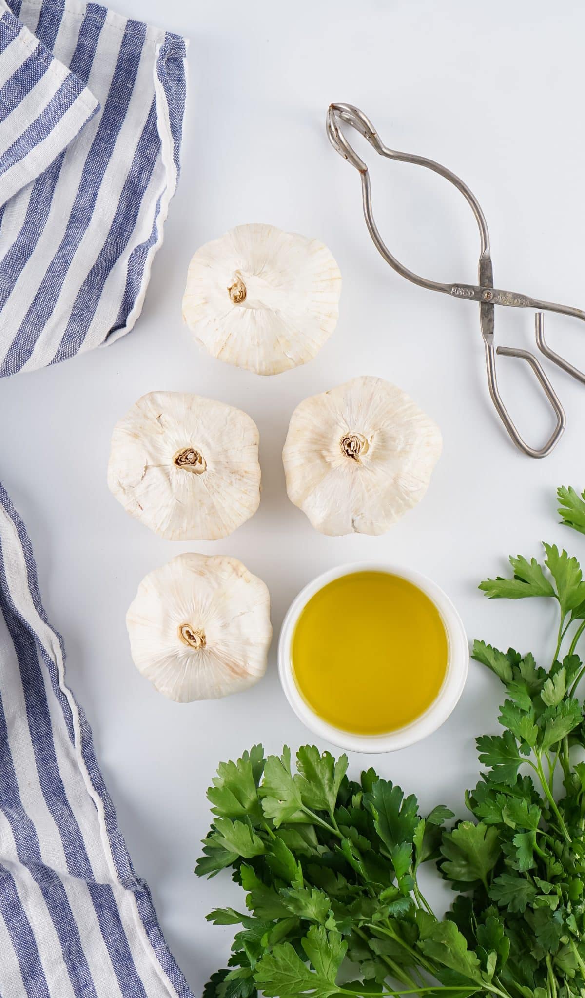 an overhead image showing the measured ingredients needed to make a batch of air fryer roasted garlic