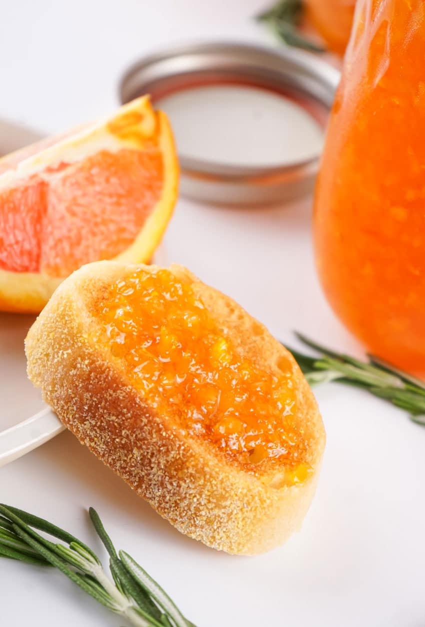 homemade orange marmalade spread on baguette slices