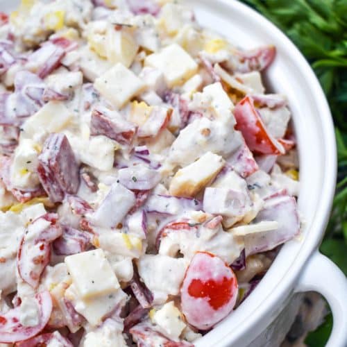 Italian grinder chicken salad in a white serving bowl