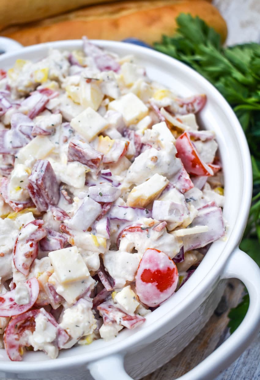 Italian grinder chicken salad in a white serving bowl