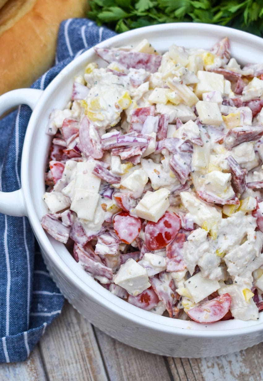Italian grinder chicken salad in a white serving bowl