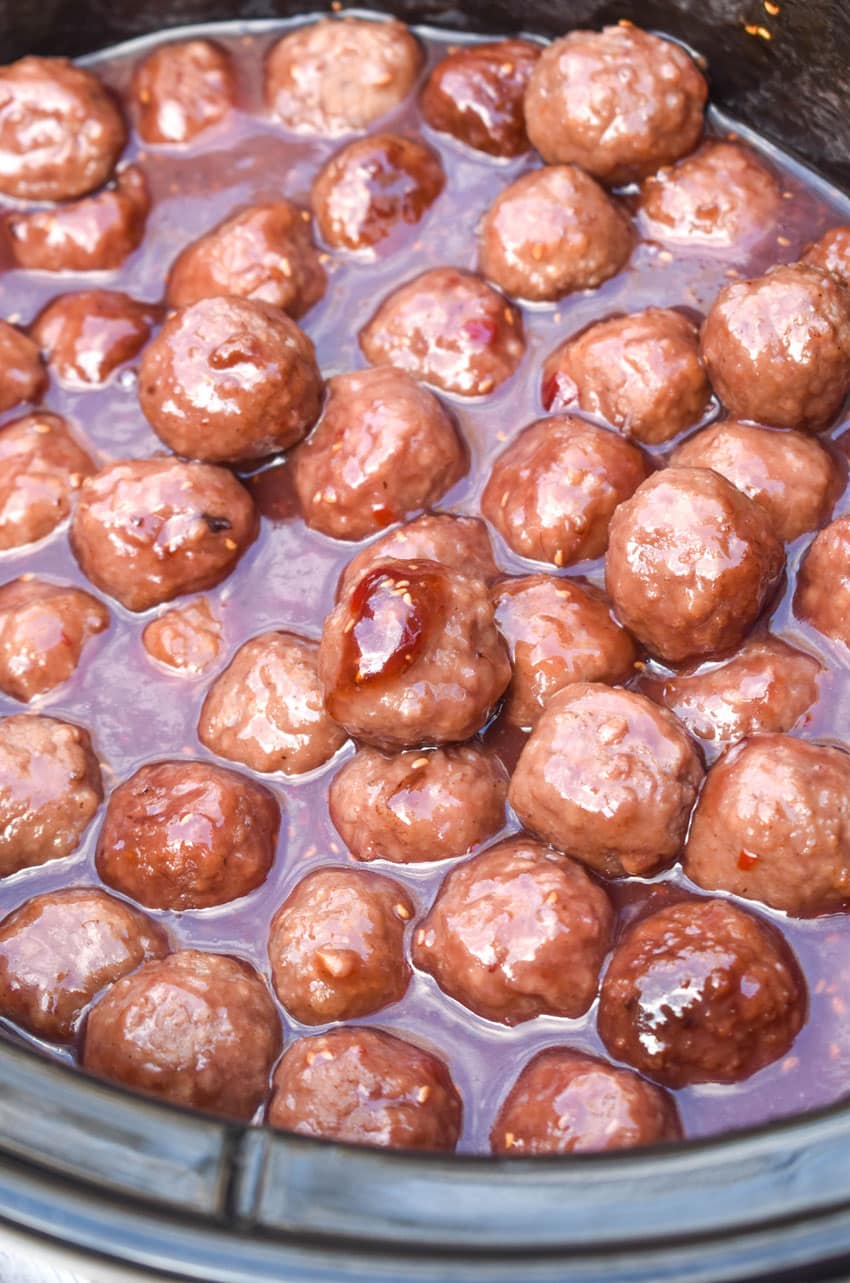 the best party meatballs in the black crock of a slow cooker
