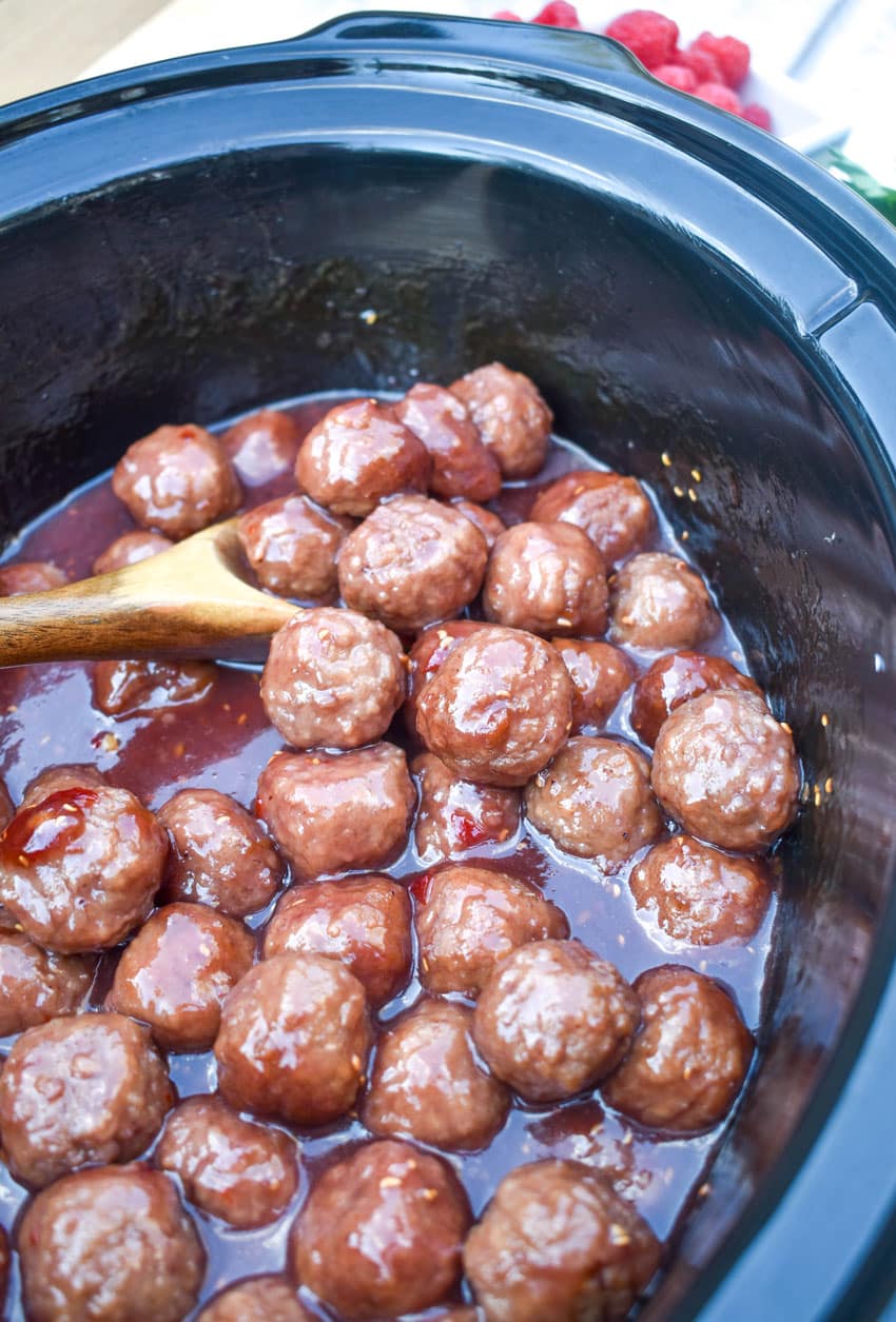 the best party meatballs in the black crock of a slow cooker