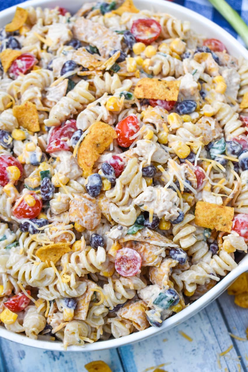 barbecue chicken pasta salad in a large white serving bowl