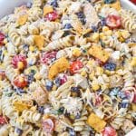 barbecue chicken pasta salad in a large white serving bowl