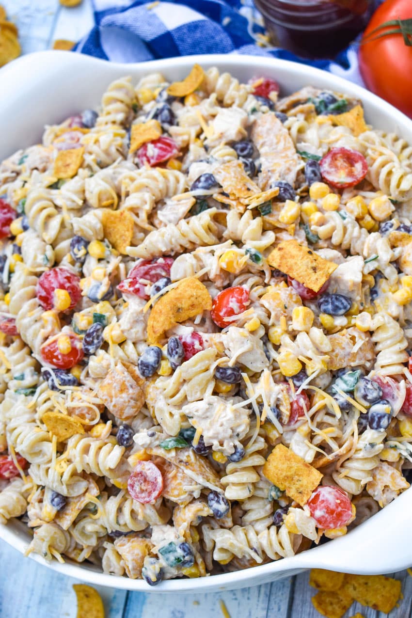 barbecue chicken pasta salad in a large white serving bowl