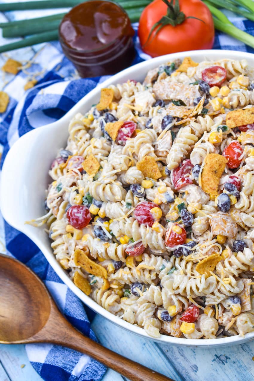 barbecue chicken pasta salad in a large white serving bowl